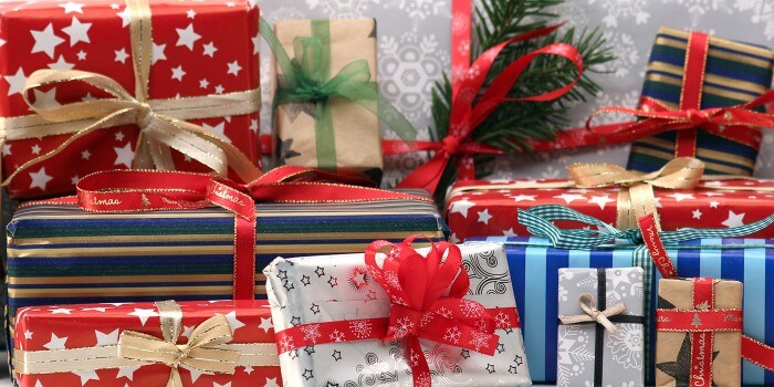 A collection of wrapped holiday gifts.